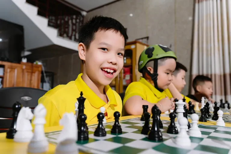 Niềm vui sau một nước hay — CLB Cờ Vua Athena